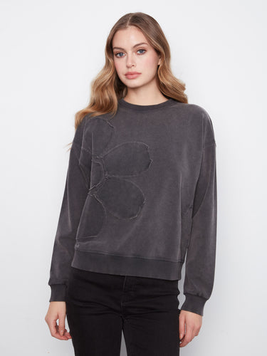 Charcoal top featuring a ribbed neck, hem and cuffs, adding texture and style by Charlie B.