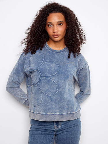 Featuring a crew neckline, this denim blue top offers casual elegance with its unique style by Charlie B.