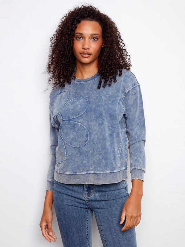 Designed with ribbed neck, hem and cuffs, this blue top combines comfort and style effortlessly by Charlie B.