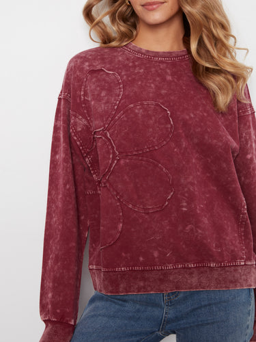 Showcasing a floral appliqué detail, this sweater adds a unique and artistic flair to your wardrobe. Crafted with care by Charlie B.