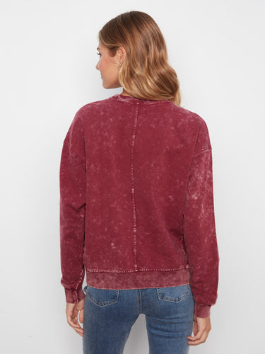 Embrace the charm of floral appliqué on this soft cotton sweater, blending artistry with everyday wearability effortlessly by Charlie B.