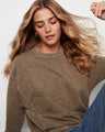 Crafted with ribbed neck, hem, and cuffs, this garment provides both style and structure for versatile wear by Charlie B.