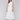 White midi eyelet dress featuring a V neckline by Charlie B.