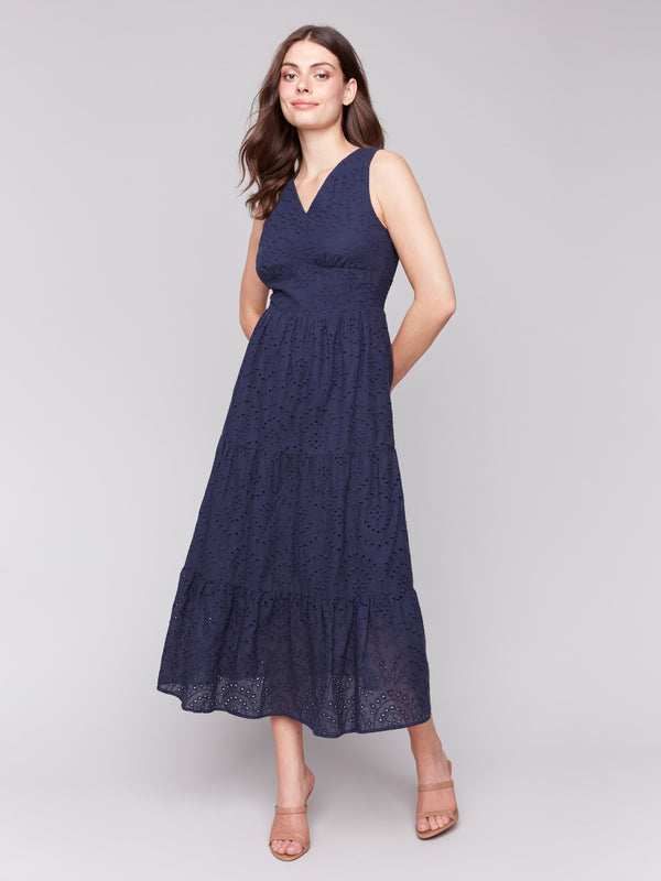 Navy blue V-neck eyelet dress featuring sleeveless design by Charlie B.