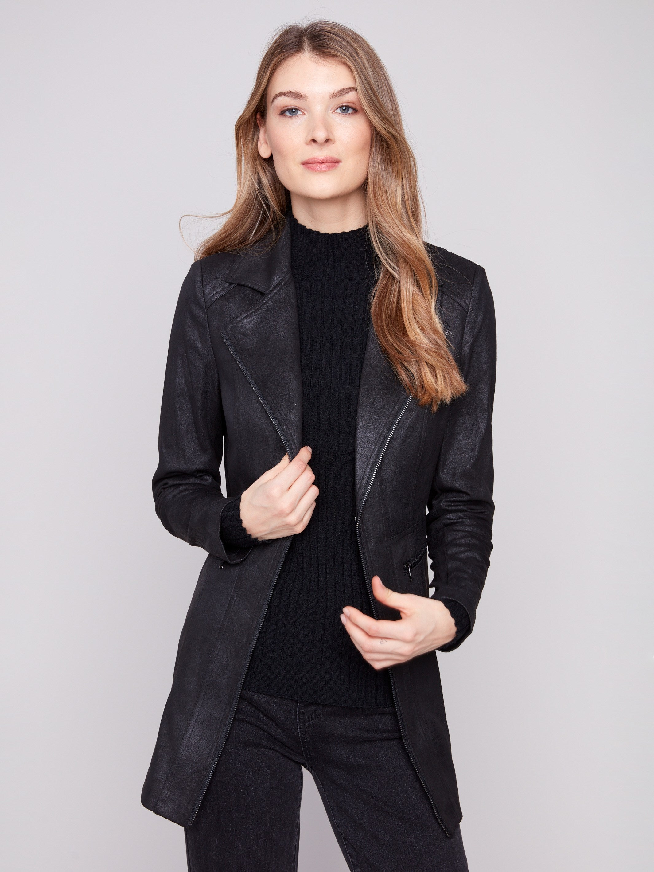 Chic black jacket with two front zipper pockets, adding functionality to its sleek design by Charlie B.