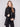 Chic black jacket with two front zipper pockets, adding functionality to its sleek design by Charlie B.