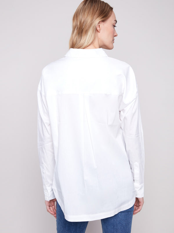 White poplin shirt with practical chest pockets, combining style and functionality by Charlie B.