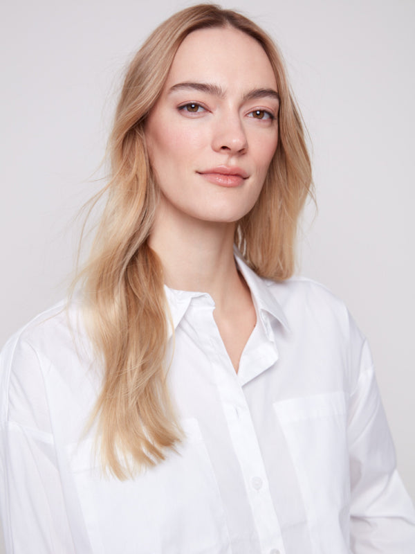 Stylish white shirt showcasing long sleeves and refined button cuffs by Charlie B.