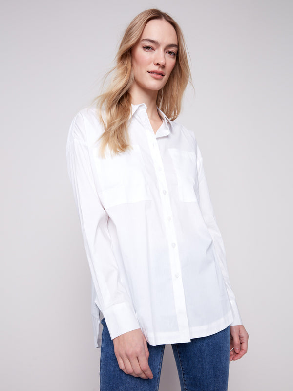 White long-sleeve poplin shirt with chest pockets and button-up front by Charlie B.