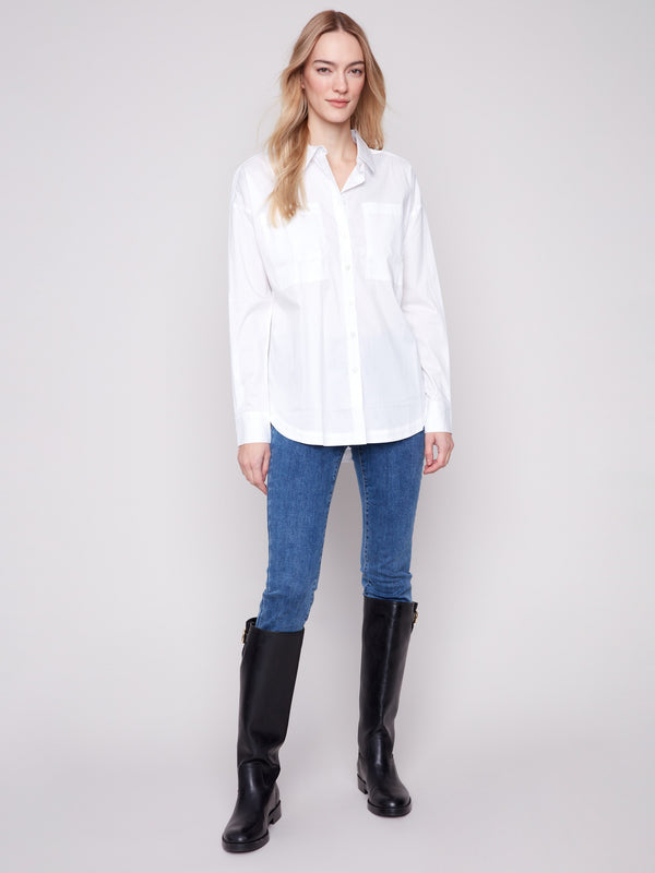 White long-sleeve poplin shirt with chest pockets and button-up front by Charlie B.