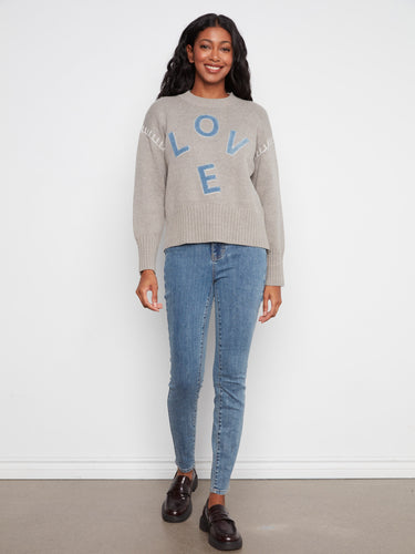 This cozy sweater showcases drop shoulder design and denim LOVE appliqué, adding charm to your wardrobe. By Charlie B.