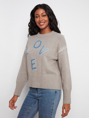 Featuring Blanchet stitch details, this sweater combines elegance with comfort effortlessly. A creation by Charlie B.