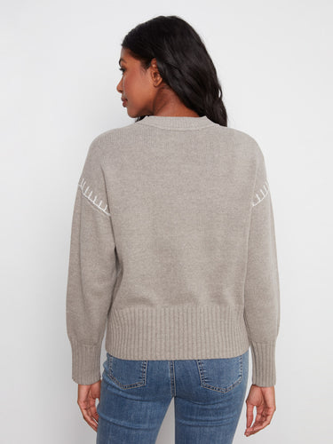 Long sleeves complement the cozy fit of this sweater, adorned with denim LOVE appliqué for added flair. Crafted by Charlie B.