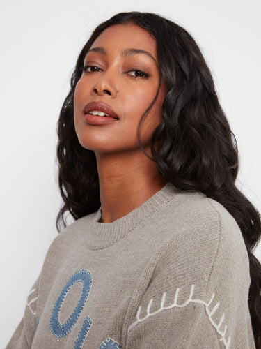 The mock neck design adds sophistication to this sweater's playful aesthetic with its unique details. Made by Charlie B.