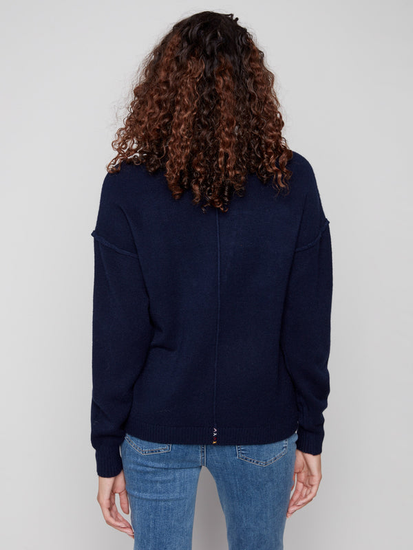 Classic navy sweater showcasing an understated back view, highlighting its relaxed fit and quality knit by Charlie B.