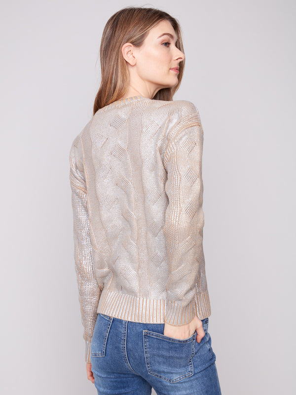 Metallic foiled sweater with intricate cable patterns and ribbed cuffs by Charlie B.