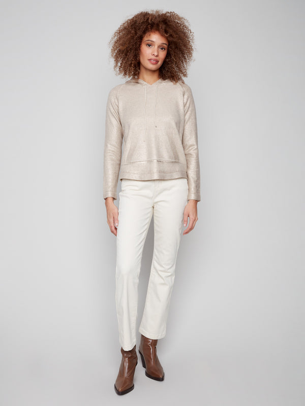 Metallic sheen enhances this champagne knit hoodie sweater, adding a touch of glamour to your wardrobe by Charlie B.