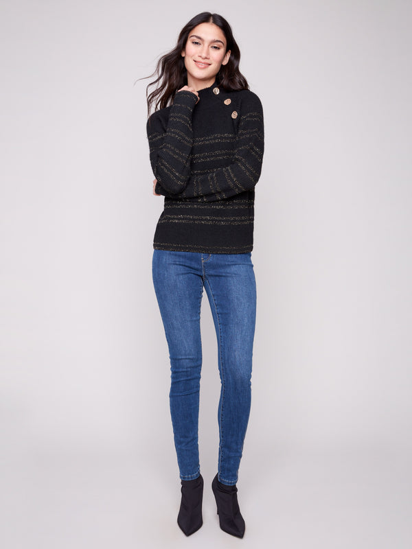 Elegant black sweater showcasing gold metallic stripes and stylish button details at the neck, designed by Charlie B.