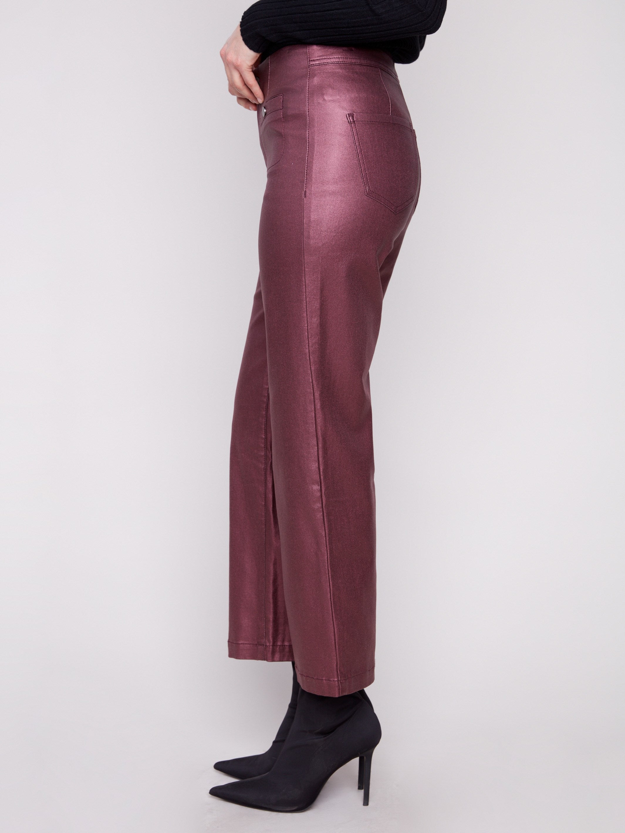 Crafted from stretch fabric, these metallic wax pants offer comfort without compromising on style by Charlie B.