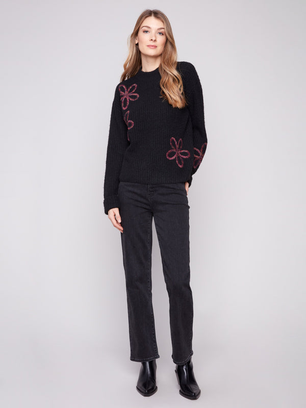 Chic black sweater featuring wide cuffs and intricate floral soutache embroidery by Charlie B.