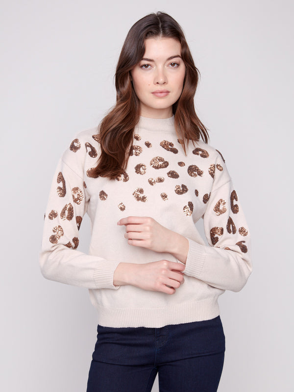 Sweater featuring a wool fabric blend with shimmering leopard sequin accents, adding a touch of elegance by Charlie B.