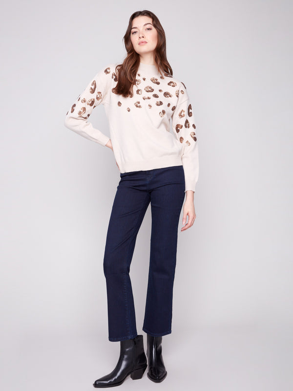 Stylish long sleeves enhance the cozy feel of this chic sweater, making it perfect for cooler days by Charlie B.