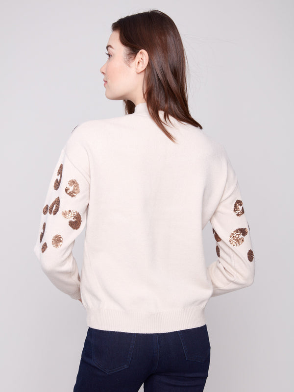 Crafted with a luxurious wool fabric blend, this sweater offers both warmth and style by Charlie B.