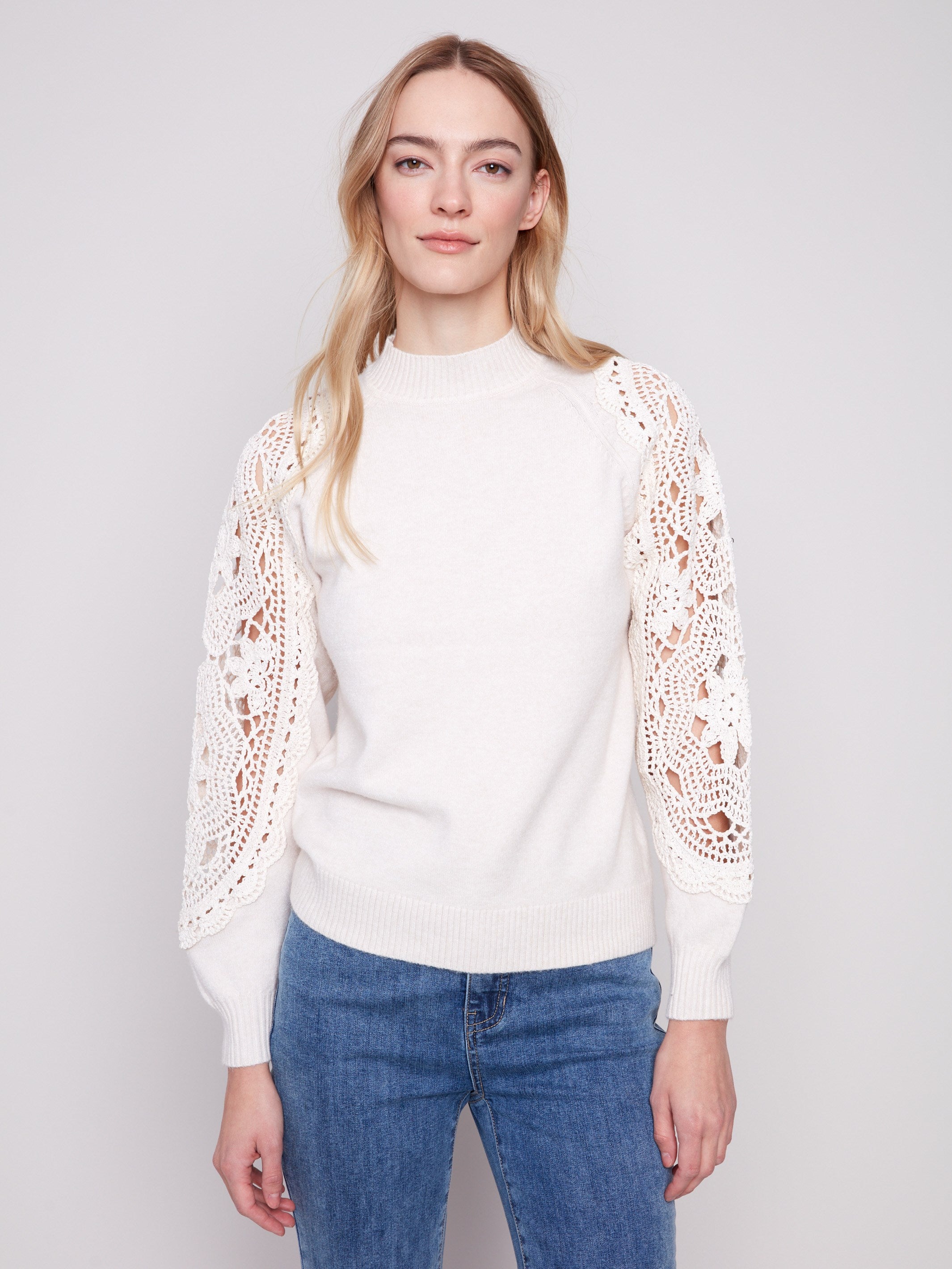 Ecru sweater featuring a sophisticated mock neck design, perfect for elevating any wardrobe with its chic style by Charlie B.
