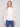 Ecru sweater featuring a sophisticated mock neck design, perfect for elevating any wardrobe with its chic style by Charlie B.