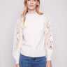Ecru sweater featuring a sophisticated mock neck design, perfect for elevating any wardrobe with its chic style by Charlie B.
