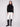 Stylish black sweater with exquisite crochet sleeves, complete with ribbed cuffs adding a touch of elegance by Charlie B.