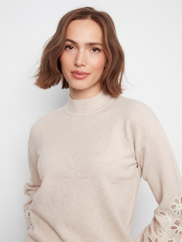 Elegant mock neck design in a soft brown hue with detailed floral sleeve embroidery, offering comfort and style by Charlie B.