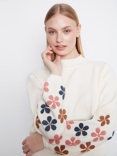 This piece features long balloon sleeves adorned with colorful floral embroidery, adding elegance to your look by Charlie B.
