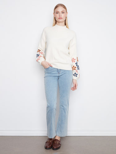 With its mock neckline and ribbed details, this sweater combines comfort and chic style effortlessly by Charlie B.