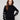 Chic black sweater with a mock neck and charming white hearts, showcasing a stylish drop shoulder design by Charlie B.