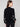 Sophisticated black sweater with intricate white heart embroidery and a comfortable drop shoulder style by Charlie B.