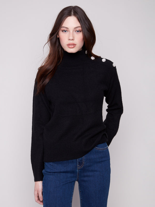 Elegant black sweater featuring a chic mock neck design, enhanced by stylish details by Charlie B.