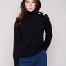 Elegant black sweater featuring a chic mock neck design, enhanced by stylish details by Charlie B.