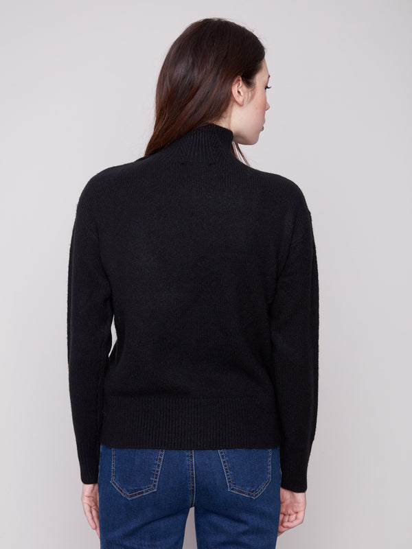 Classic black knit with ribbed cuffs and cozy wool blend fabric for ultimate comfort by Charlie B.