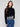 Black sweater featuring a chic drop shoulder design and white floral lace hem, perfect for stylish comfort by Charlie B.