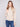 Elegant sweater with mock neck and intricate floral embroidery, adding a touch of sophistication by Charlie B.