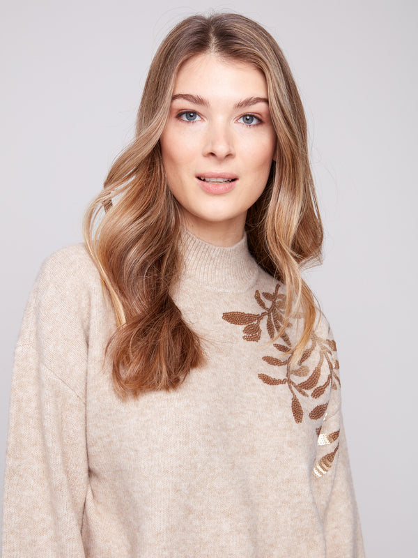 Chic heather oat sweater featuring sequin floral design, perfect for a stylish look by Charlie B.