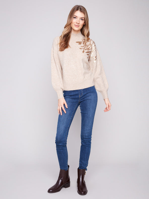 Stylish drop shoulders design enhances the relaxed fit of this embroidered sweater by Charlie B.