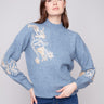 Denim sweater with exquisite floral embroidery and sequins, showcasing a stylish mock neck by Charlie B.