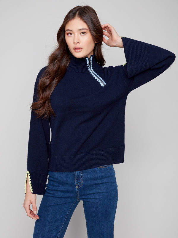 Chic navy sweater with mock neck design offers both warmth and style for cooler days by Charlie B.