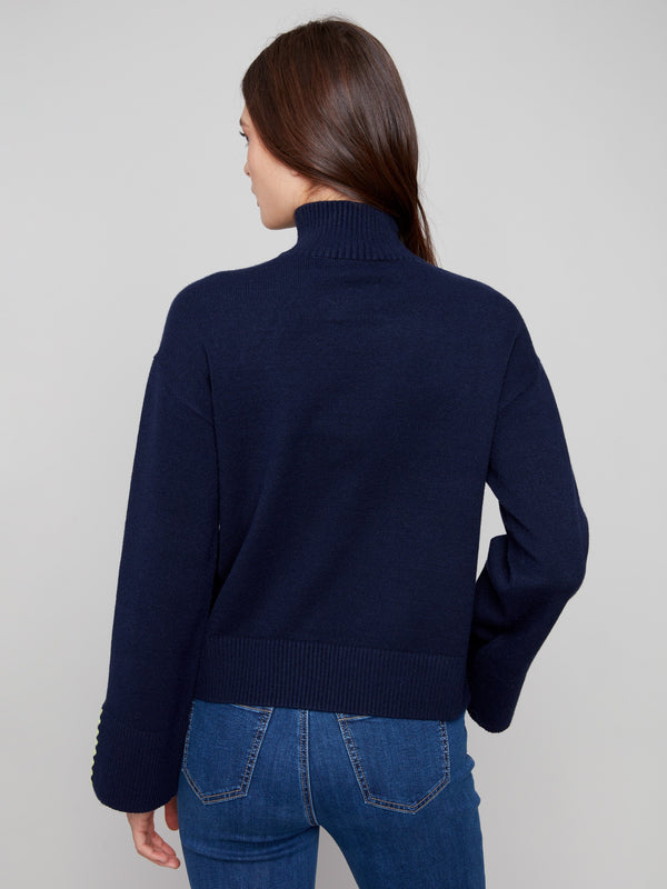 Sophisticated navy sweater with open sleeve cuffs provides comfort and flair for any occasion by Charlie B.