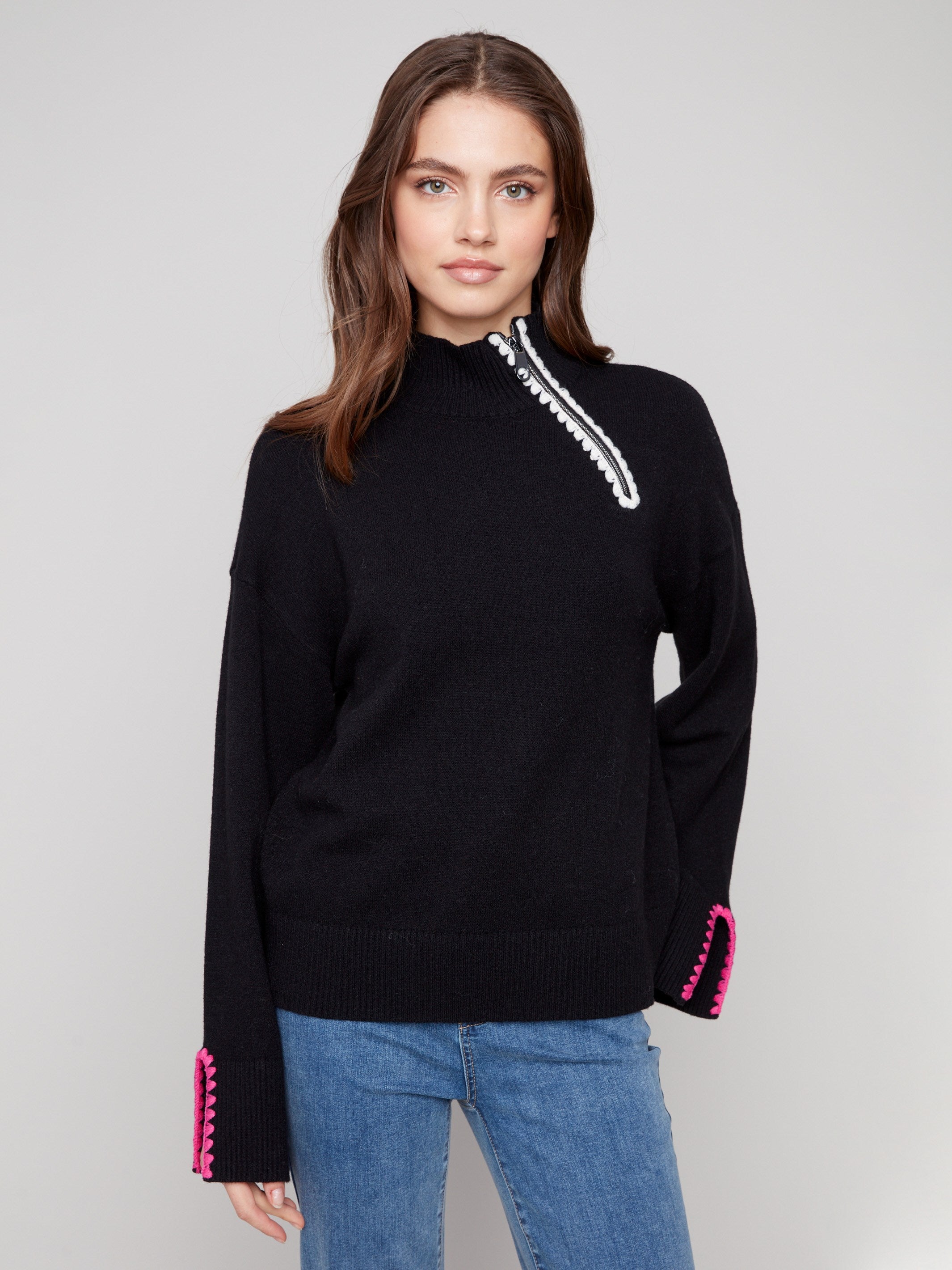 Elegant black sweater featuring a mock neck design with stylish crochet accents by Charlie B.