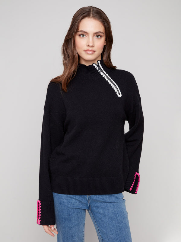 Elegant black sweater featuring a mock neck design with stylish crochet accents by Charlie B.