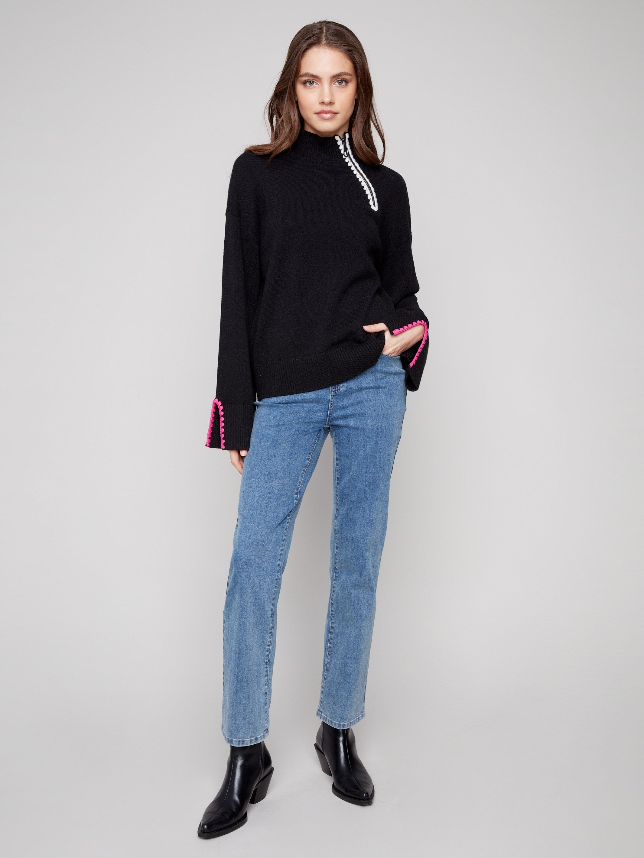 Sophisticated black sweater with open sleeve cuffs adding a touch of flair by Charlie B.