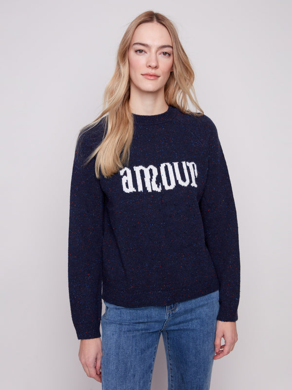 Navy sweater featuring 'amour' graphic with flecked yarn detail, perfect for cozy days by Charlie B.